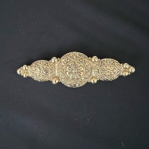Ornate Gold-Tone Decorative Brooch